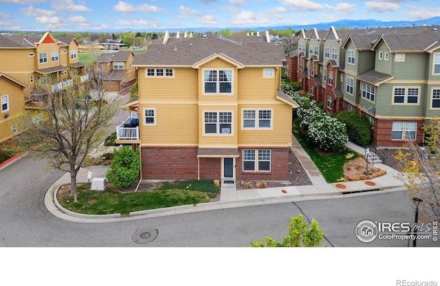 12820 King St, Broomfield, CO 80020 - townhome / multi-family property featuring a residential view and brick siding
