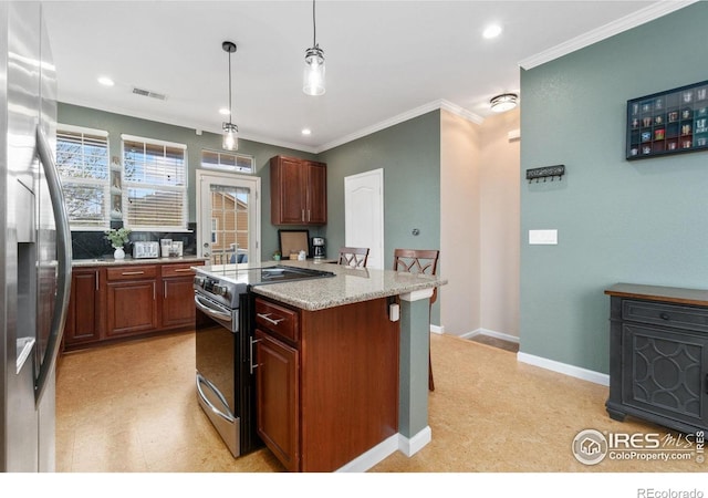 12820 King St, Broomfield, CO 80020 - kitchen featuring stainless steel appliances, ornamental molding, a kitchen island, pendant lighting, and recessed lighting