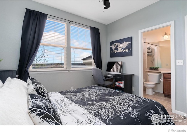12820 King St, Broomfield, CO 80020 - bedroom featuring multiple windows, ensuite bath, light tile patterned flooring, and a desk