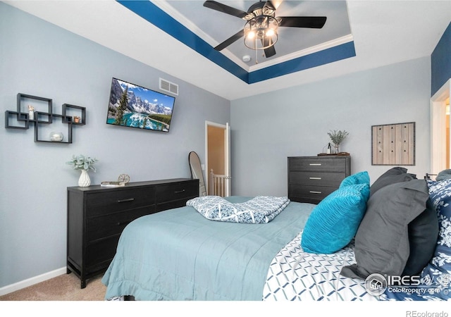 12820 King St, Broomfield, CO 80020 - bedroom featuring light colored carpet, a raised ceiling, baseboards, and ceiling fan