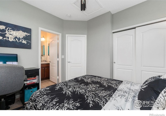 12820 King St, Broomfield, CO 80020 - bedroom with a closet, attic access, connected bathroom, and tile patterned floors