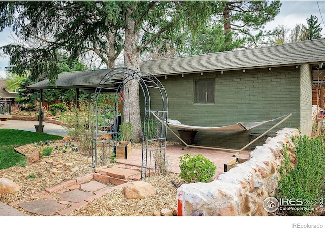 845 14th St, Boulder, CO 80302 - view of front of property featuring brick siding and a shingled roof
