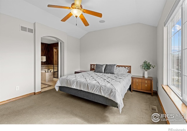 4822 Raven Run, Broomfield, CO 80023 - bedroom with visible vents, arched walkways, carpet floors, and vaulted ceiling