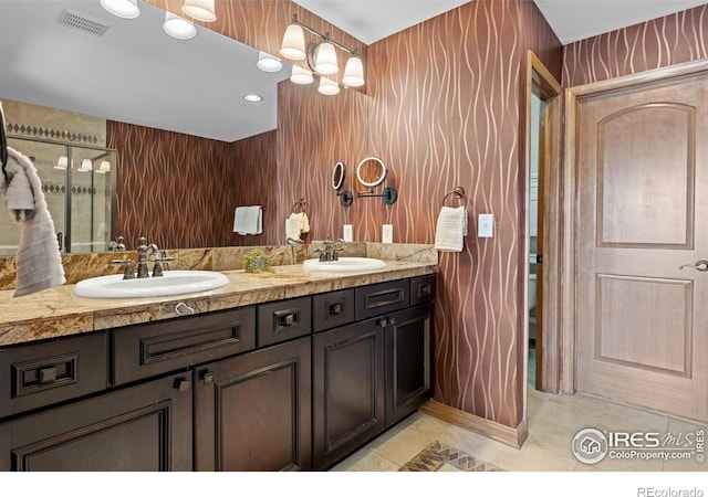 4822 Raven Run, Broomfield, CO 80023 - bathroom featuring a sink, double vanity, and visible vents