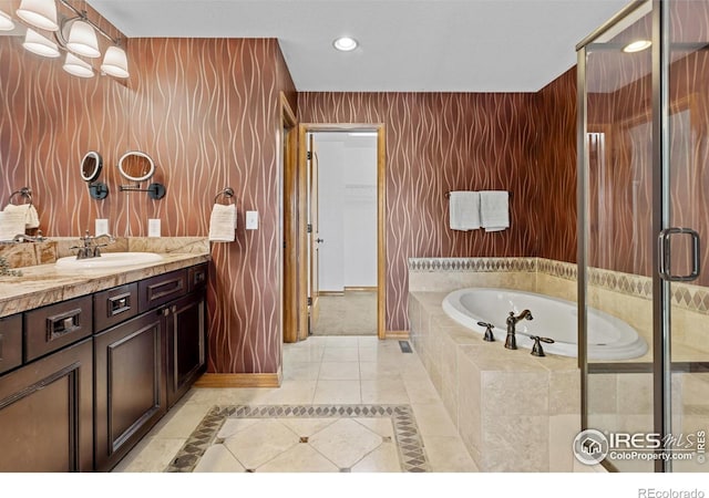 4822 Raven Run, Broomfield, CO 80023 - bathroom with a garden tub, tile patterned flooring, vanity, baseboards, and recessed lighting