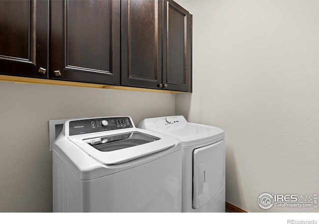 4822 Raven Run, Broomfield, CO 80023 - laundry room with cabinet space and washing machine and clothes dryer