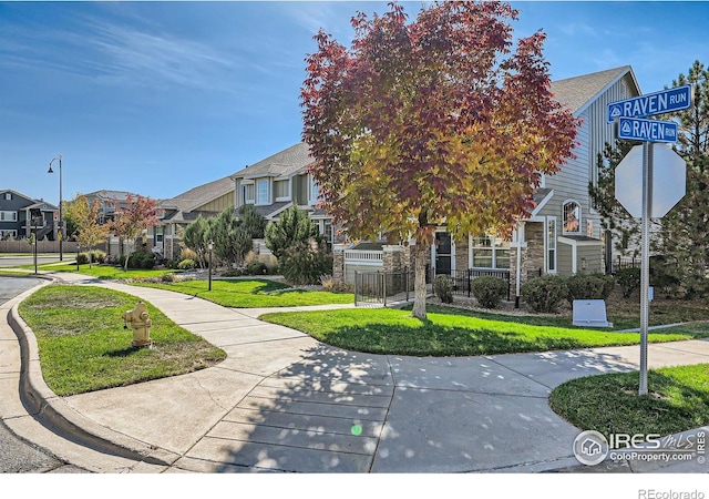 4822 Raven Run, Broomfield, CO 80023 - surrounding community with a lawn, fence, and a residential view