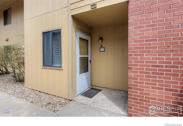 doorway to property with board and batten siding