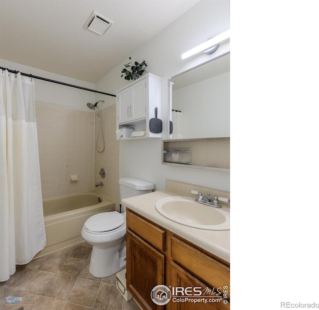 bathroom featuring vanity, shower / bath combo with shower curtain, toilet, and visible vents