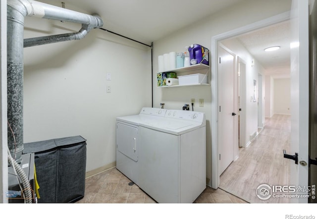 laundry area with laundry area and washer and clothes dryer