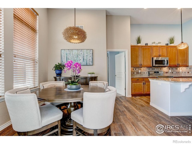 14394 W 88th Dr Unit C, Arvada, CO 80005 - dining room with wood finished floors and visible vents