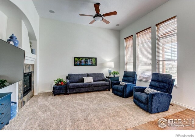 14394 W 88th Dr Unit C, Arvada, CO 80005 - living area with a ceiling fan, a tile fireplace, and wood finished floors