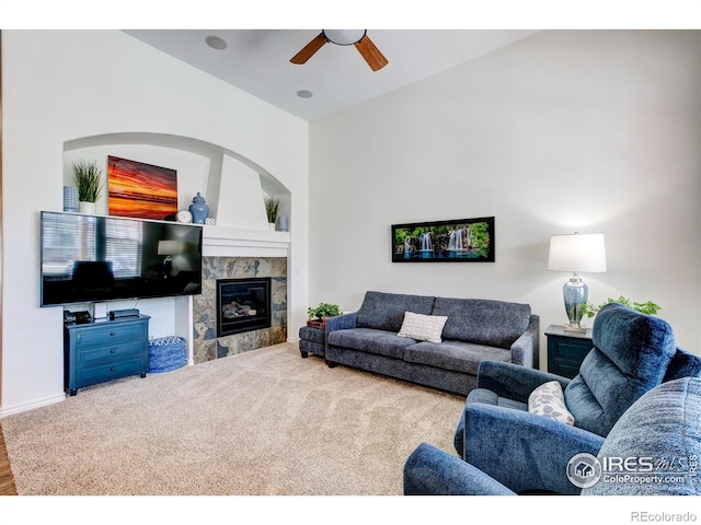 14394 W 88th Dr Unit C, Arvada, CO 80005 - living room featuring wood finished floors, ceiling fan, baseboards, and a tile fireplace