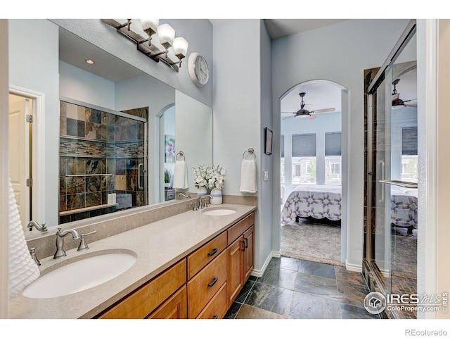 14394 W 88th Dr Unit C, Arvada, CO 80005 - bathroom featuring a sink, a ceiling fan, ensuite bath, and double vanity