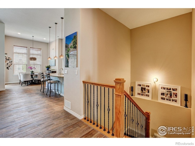 14394 W 88th Dr Unit C, Arvada, CO 80005 - stairs featuring baseboards, recessed lighting, wood finished floors, and visible vents