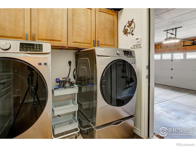 14394 W 88th Dr Unit C, Arvada, CO 80005 - laundry area with cabinet space and washing machine and clothes dryer