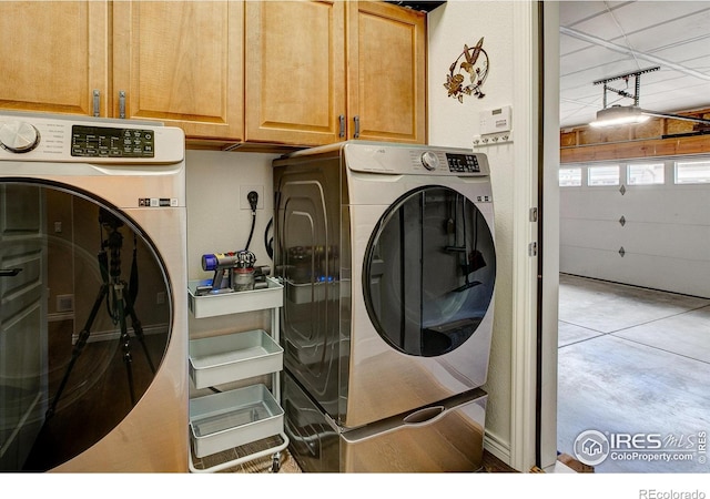 14394 W 88th Dr Unit C, Arvada, CO 80005 - laundry area featuring cabinet space and independent washer and dryer