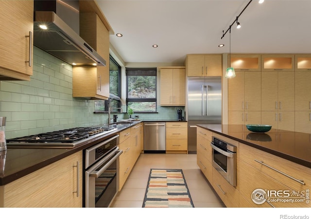 451 Red Gulch Rd, Lyons, CO 80540 - kitchen featuring dark countertops, light brown cabinets, stainless steel appliances, and wall chimney exhaust hood