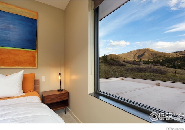 451 Red Gulch Rd, Lyons, CO 80540 - carpeted bedroom featuring baseboards and a mountain view