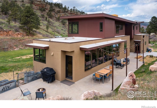 451 Red Gulch Rd, Lyons, CO 80540 - back of property featuring a patio area