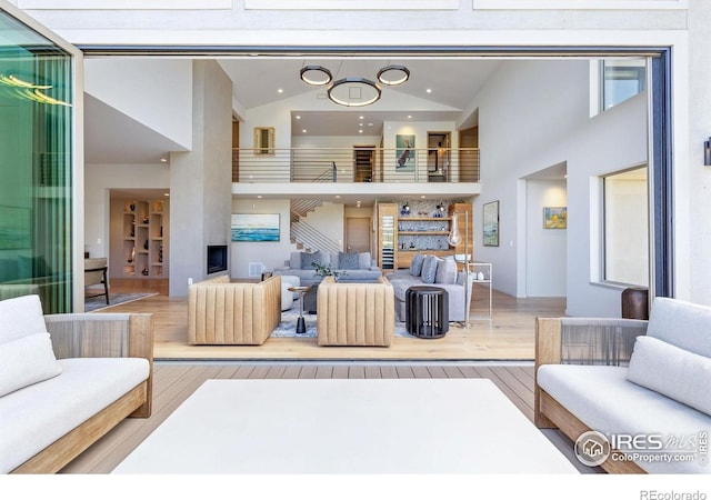 50 Wildwood Ln, Boulder, CO 80304 - living area with wood finished floors, high vaulted ceiling, and recessed lighting