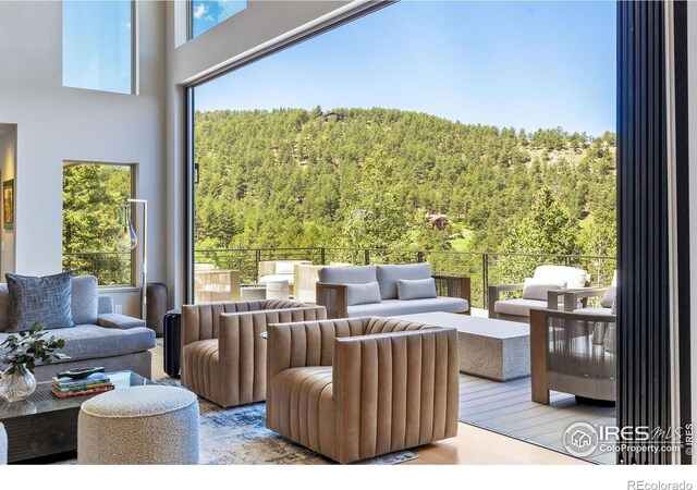 50 Wildwood Ln, Boulder, CO 80304 - living room with a wooded view and wood finished floors