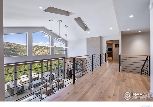 50 Wildwood Ln, Boulder, CO 80304 - hall with an upstairs landing, light wood-style flooring, high vaulted ceiling, and recessed lighting