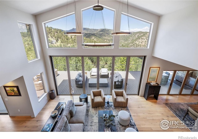 50 Wildwood Ln, Boulder, CO 80304 - living area featuring a high ceiling, plenty of natural light, wood finished floors, and a mountain view