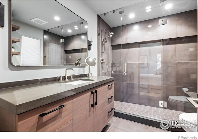 50 Wildwood Ln, Boulder, CO 80304 - bathroom with vanity, tile patterned floors, a shower stall, and recessed lighting