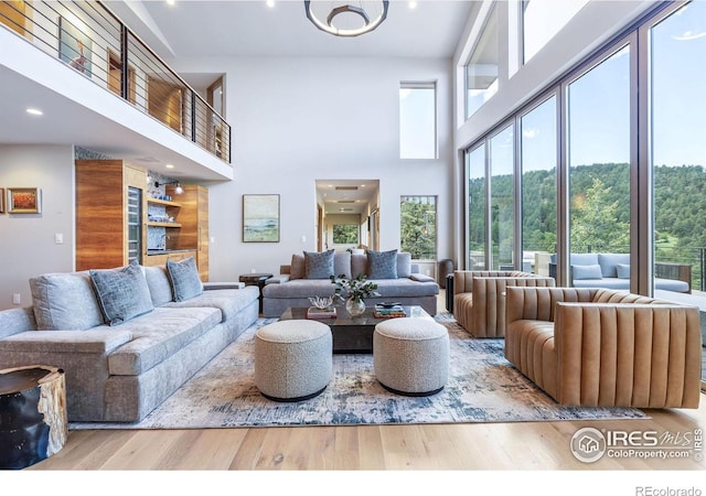 50 Wildwood Ln, Boulder, CO 80304 - living room with wood finished floors, a towering ceiling, and recessed lighting