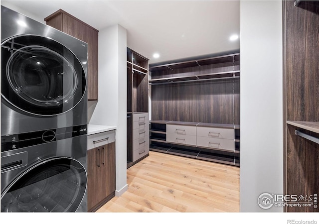 50 Wildwood Ln, Boulder, CO 80304 - laundry room with estacked washer and dryer, light wood-style flooring, cabinet space, and recessed lighting