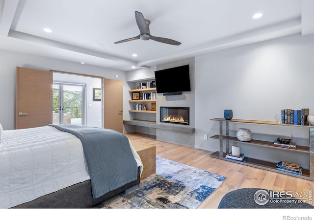 50 Wildwood Ln, Boulder, CO 80304 - bedroom featuring a glass covered fireplace, wood finished floors, recessed lighting, and a ceiling fan
