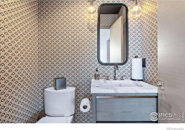 50 Wildwood Ln, Boulder, CO 80304 - bathroom featuring vanity and wallpapered walls