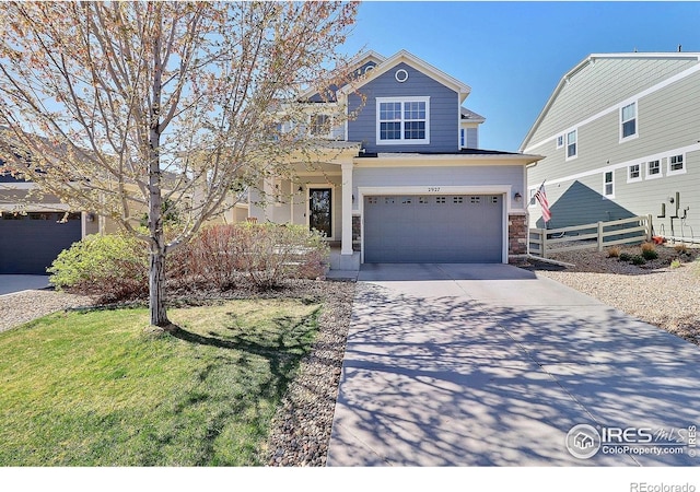 2927 Percheron Dr, Fort Collins, CO 80525 - view of front of house featuring a front lawn, fence, stone siding, an attached garage, and driveway