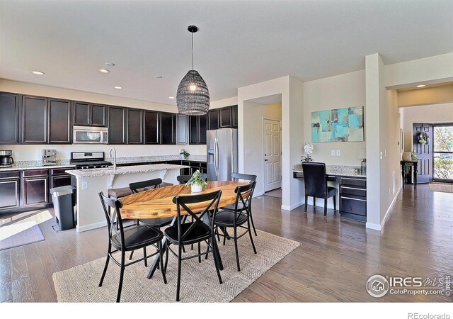 2927 Percheron Dr, Fort Collins, CO 80525 - dining room with recessed lighting, baseboards, and wood finished floors
