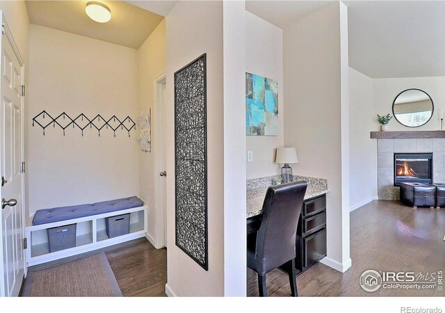 2927 Percheron Dr, Fort Collins, CO 80525 - office area with baseboards, wood finished floors, and a fireplace