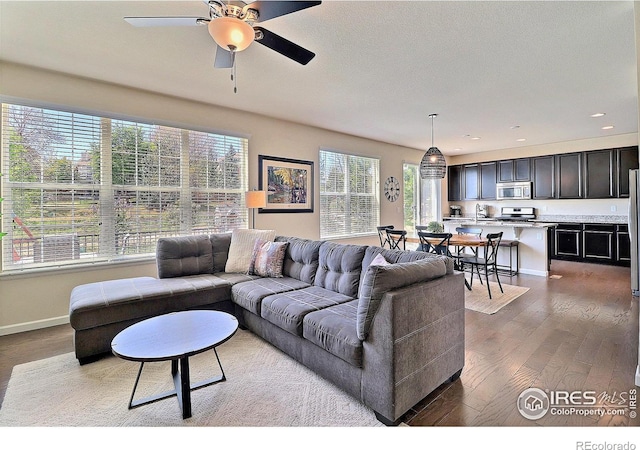 2927 Percheron Dr, Fort Collins, CO 80525 - living area with recessed lighting, a ceiling fan, baseboards, and wood finished floors