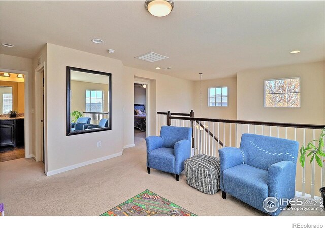 2927 Percheron Dr, Fort Collins, CO 80525 - living area with baseboards, recessed lighting, visible vents, and light carpet