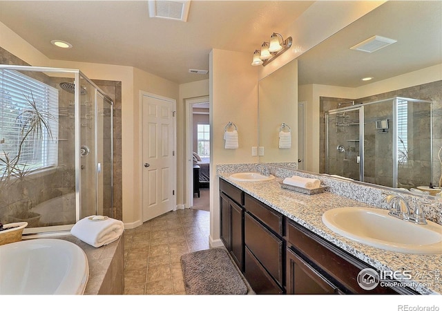 2927 Percheron Dr, Fort Collins, CO 80525 - full bath featuring visible vents, a sink, ensuite bath, and a shower stall