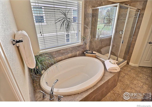 2927 Percheron Dr, Fort Collins, CO 80525 - full bathroom with tile patterned floors, a shower stall, and a bath