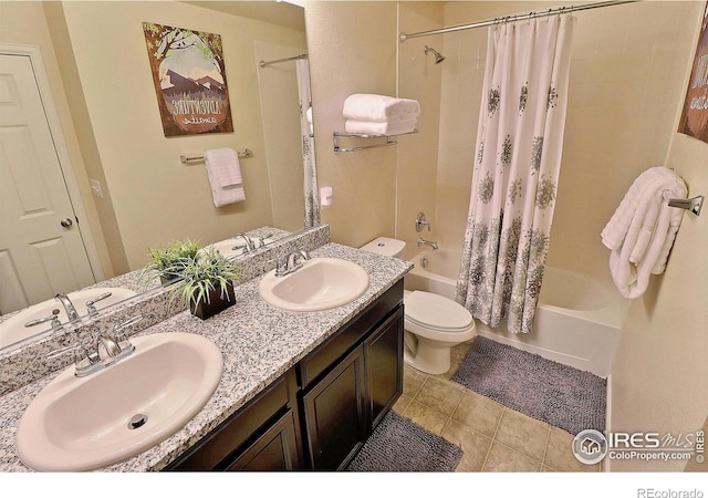 2927 Percheron Dr, Fort Collins, CO 80525 - full bath with a sink, shower / bath combo with shower curtain, toilet, and double vanity