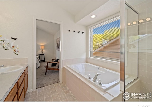 1532 Corydalis Ct, Fort Collins, CO 80526 - bathroom featuring a bath, vanity, vaulted ceiling, tile patterned floors, and a tile shower