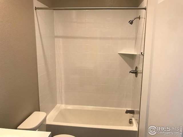 4672 Clear Creek Dr, Longmont, CO 80504 - full bathroom with shower / bathing tub combination, a textured wall, and toilet