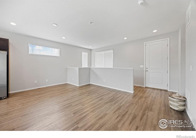 4672 Clear Creek Dr, Longmont, CO 80504 - unfurnished room featuring light wood-style floors, baseboards, recessed lighting, and a smoke detector