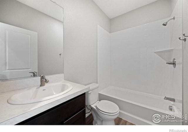 4672 Clear Creek Dr, Longmont, CO 80504 - full bath with toilet, vanity, bathtub / shower combination, and wood finished floors