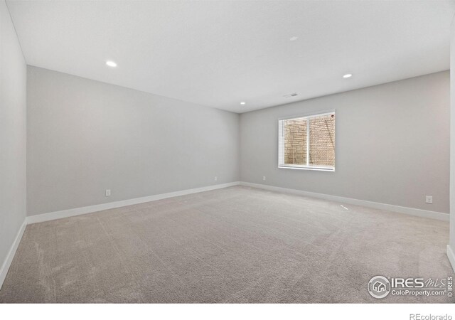 4672 Clear Creek Dr, Longmont, CO 80504 - spare room with recessed lighting, baseboards, and carpet