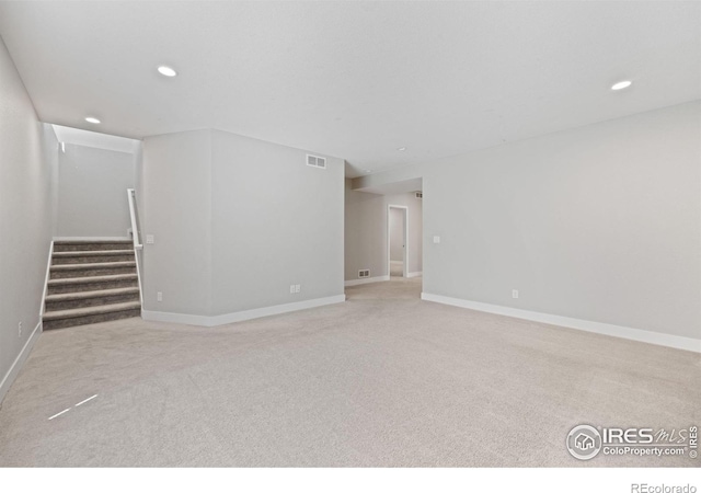 4672 Clear Creek Dr, Longmont, CO 80504 - unfurnished living room featuring carpet, recessed lighting, stairs, and baseboards
