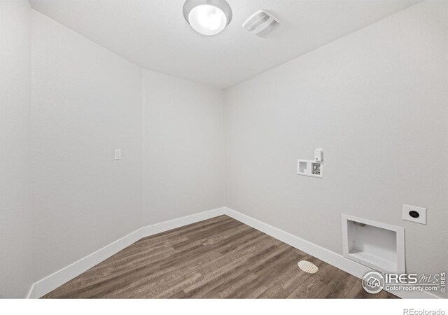 4672 Clear Creek Dr, Longmont, CO 80504 - laundry room with hookup for an electric dryer, wood finished floors, washer hookup, and baseboards