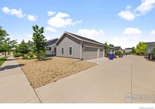 4672 Clear Creek Dr, Longmont, CO 80504 - view of front of house featuring driveway and a garage