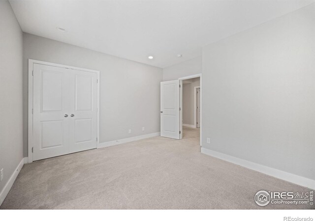 4672 Clear Creek Dr, Longmont, CO 80504 - unfurnished bedroom with carpet, baseboards, recessed lighting, and a closet